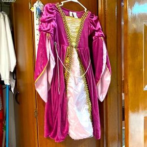 This is a light purple Rapunzel dress that has been used twice with no rips